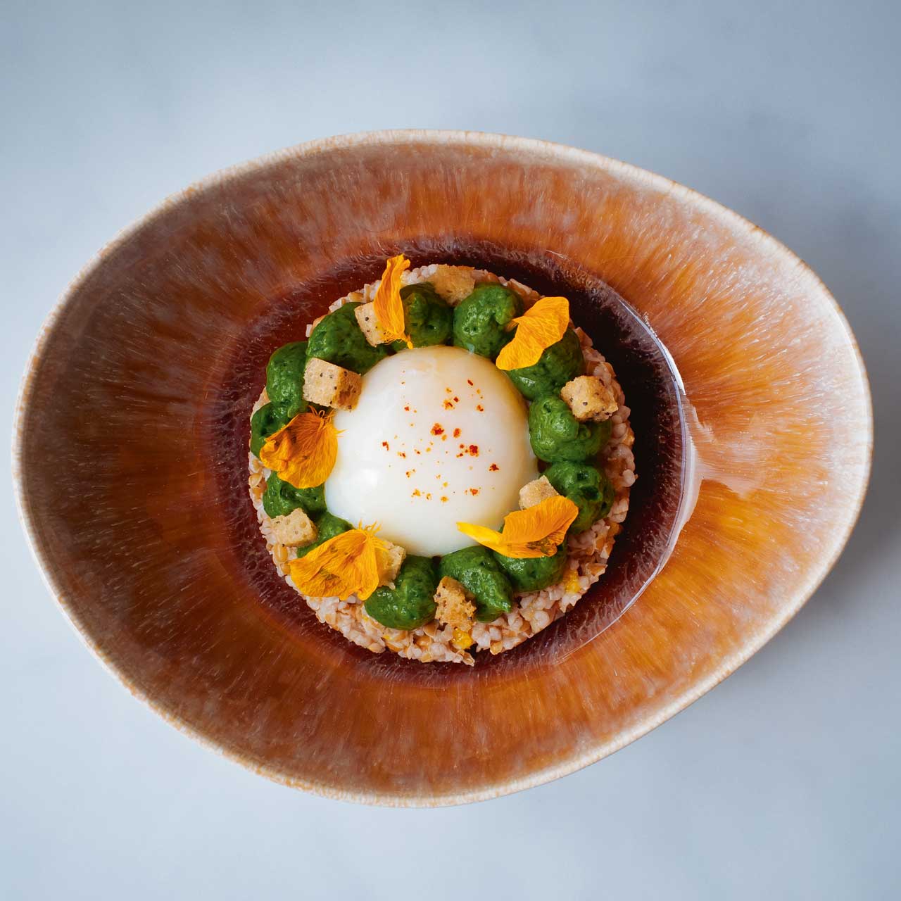 Oeuf parfait is one of Le Collectionneur's most eye-catching dishes