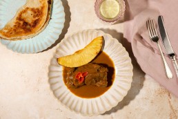 The Good Front Room at The Langham Curry Goat